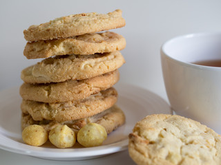 White chocolate and macadamia nut cookies with a cup of tea