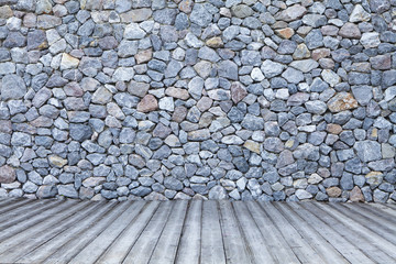 The rock walls and wooden floor.