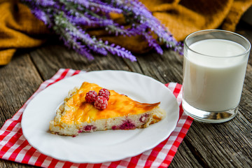 Fototapeta na wymiar delicious pie with cottage cheese with raspberry