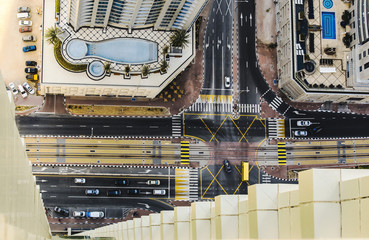 Rooftop view of a road intersection in Dubai Marina with hotels and traffic