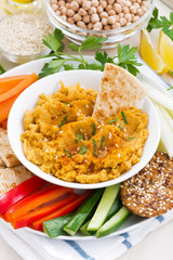 Arabic sauce hummus with fresh vegetables and pita bread