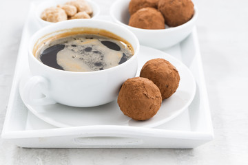 chocolate truffles and a cup of coffee