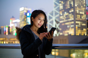 Woman use of mobile phone at Hong Kong