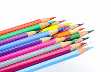Many colored wooden pencils on white.