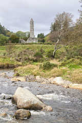 View of ruins of the high tower of Glendalough, Ireland