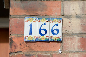 House number 166 sign