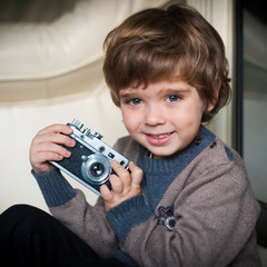 little boy with a camera