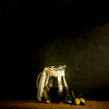 Olives and olive oil in vintage jar