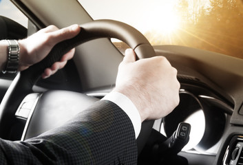  close up of young man driving car