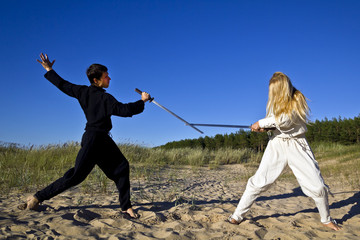 Medieval man and woman are fighting