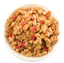 Breakfast cereal with dried raspberry fruit pieces in white bowl over white background