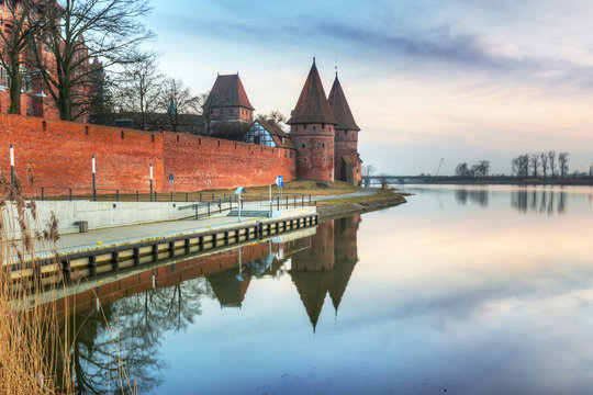The Castle of the Teutonic Order in Malbork at sunset, Poland