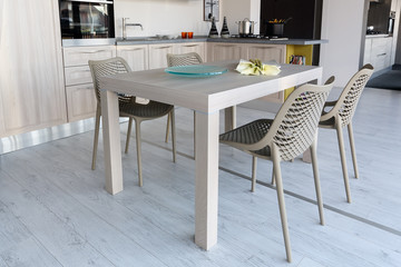 Modern style kitchen in cream and grey color