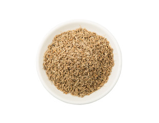 Dried dill herbs in white bowl over white background