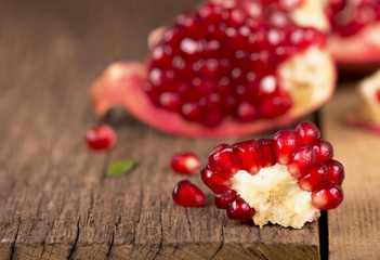 pomegranates on a wooden background