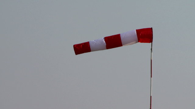 View of red and white windsock waving