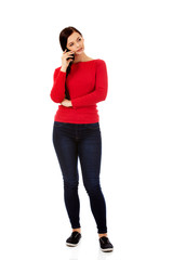 Young student woman talking through a mobile phone