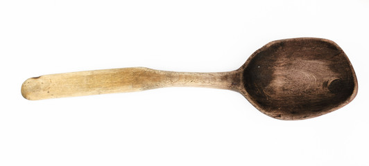 Used self-made wooden spoon isolated. Close-up top view of wooden spoon isolated over white. Wooden...