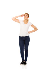 Fototapeta premium Pensive young woman scratching her head