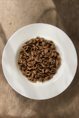 Whole wheat pasta in the white plate