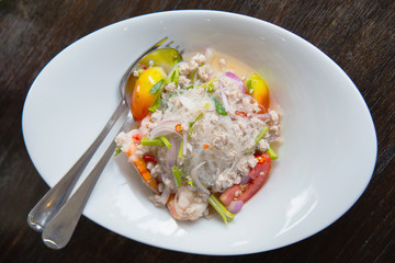 Thai spicy glass noodle salad with seafood on the plate