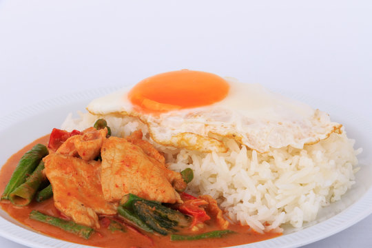 Fried pork curry, Stir fried pork and red curry paste with sunny side up egg (Moo Pad Prik Gaeng). Thai food.
