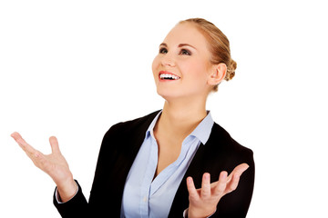 Happy business woman trying to catch something