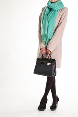 Black purse and turquoise scarf.