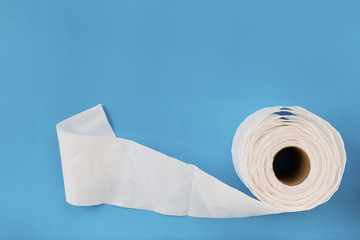 Tissue paper roll on the blue background.