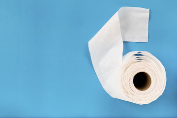 Tissue paper roll on the blue background.