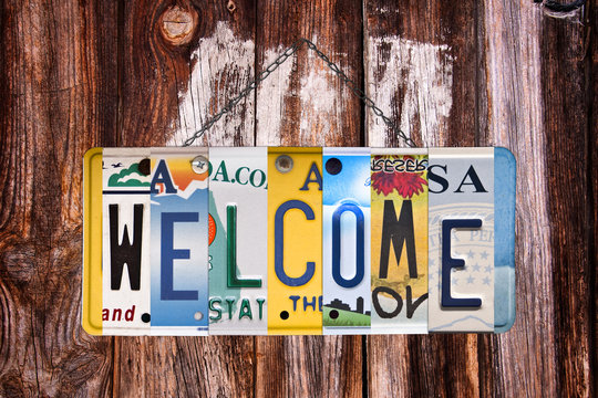 Welcome sign written with recycled US license plates