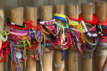 bands/ friendship bands tied to a gate