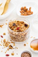 healthy breakfast. Fresh granola with goji and honey on a white 