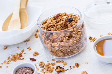 Granola with honey on a white background. healthy breakfast.