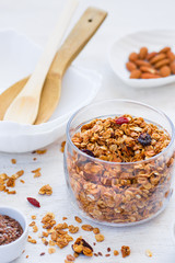 Granola with almonds on a white background, healthy breakfast.