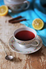 Cup of tea on wooden table. vintage scene.