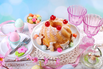 easter ring cake with cherry decoration and icing sugar