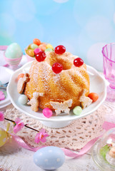 easter ring cake with cherry decoration and icing sugar