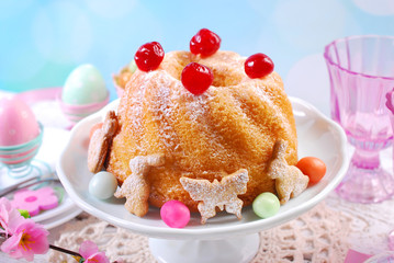 easter ring cake with cherry decoration and icing sugar