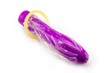 vibrator and condom isolated on white background
