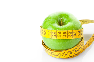 green apple with measure tape