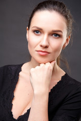 Close up portrait of elegant brunette woman with nude make up. Emotions, emotional portraits