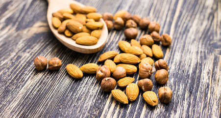 Almonds in wooden spoon 