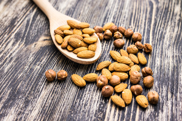 Almonds on wooden background