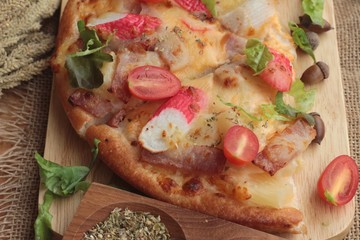 Italian pizza is delicious on wood background.