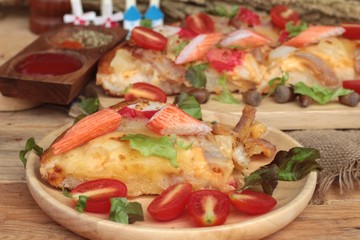 Italian pizza is delicious on wood background.