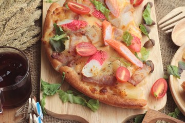 Italian pizza is delicious on wood background.