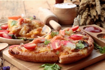 Italian pizza is delicious on wood background.