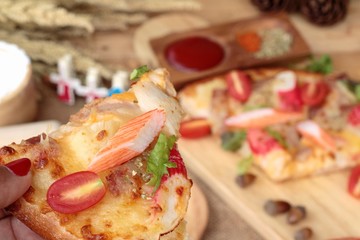 Italian pizza is delicious on wood background.
