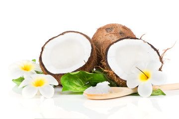 Coconut with green leaf on white background
